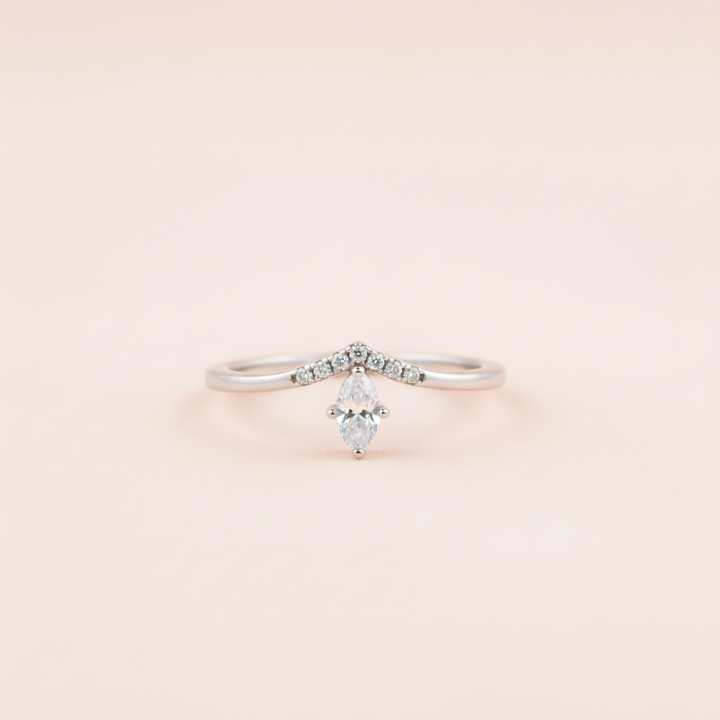Luna Marquise Ring with a baby-pink and rose-gold background